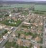 Photos aériennes de "dame" - Photo réf. 174055 - Le coeur du village et son glise paroissiale Sainte-Barbe de 1938, surnomme  La Dame de Fer . C'est la dernire glise d'Europe construite en fer.