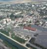 Photos aériennes de "la-haut" - Photo réf. 719207 - Le canal de Bourgogne sparant les deux parties de la ville et l'glise du Christ Roi qui se distigue par une flche de plus de 60 m de haut