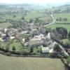 Photos aériennes de "Place" - Photo réf. 21377 - La place du bourg avec l'unique commerce du village et la trs belle petite glise romane.
