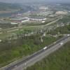 Photos aériennes de "autoroute" - Photo réf. N009456 - Le long de l'autoroute A13, la silhouette du chteau Robert-le-Diable  l'arrire, la Seine et l'activit industrielle aux abords de Rouen.