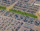 Photos aériennes de Creutzwald (57150) - La Zone Industrielle Lourde | Moselle, Lorraine, France - Photo réf. T100676 - Un parking automobile rempli de voitures neuves.