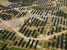 Photos aériennes de "2011" - Photo réf. U112211 - Le chantier d'installation de la plus puissante centrale photovoltaique du monde sur l'ancienne base arienne 136 de Toul-Rosires par EDF Energies Nouvelles au 1er Aot 2011.
