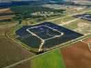 Photos aériennes de "2011" - Photo réf. U113124 - Le chantier d'installation de la plus puissante centrale photovoltaique du monde sur l'ancienne base arienne 136 de Toul-Rosires par EDF Energies Nouvelles au 29 Aot 2011.