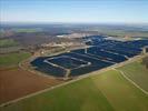 Photos aériennes de "Solaire" - Photo réf. U115352 - Le chantier d'installation de la plus puissante centrale photovoltaique du monde sur l'ancienne base arienne 136 de Toul-Rosires par EDF Energies Nouvelles au 16 Janvier 2012.