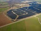 Photos aériennes de "Solaire" - Photo réf. U115353 - Le chantier d'installation de la plus puissante centrale photovoltaique du monde sur l'ancienne base arienne 136 de Toul-Rosires par EDF Energies Nouvelles au 16 Janvier 2012.