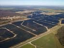 Photos aériennes de "Solaire" - Photo réf. U115354 - Le chantier d'installation de la plus puissante centrale photovoltaique du monde sur l'ancienne base arienne 136 de Toul-Rosires par EDF Energies Nouvelles au 16 Janvier 2012.