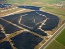 Photos aériennes de "photovoltaique" - Photo réf. U115358 - Le chantier d'installation de la plus puissante centrale photovoltaique du monde sur l'ancienne base arienne 136 de Toul-Rosires par EDF Energies Nouvelles au 16 Janvier 2012.