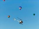 Photos aériennes de "ciel" - Photo réf. E145958 - L'hlicoptre de l'Europe vue du ciel en plein travail de prises de vues ariennes autour des montgolfires du Mondial Air Ballons 2013.