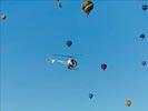 Photos aériennes de "ciel" - Photo réf. E145959 - L'hlicoptre de l'Europe vue du ciel en plein travail de prises de vues ariennes autour des montgolfires du Mondial Air Ballons 2013.